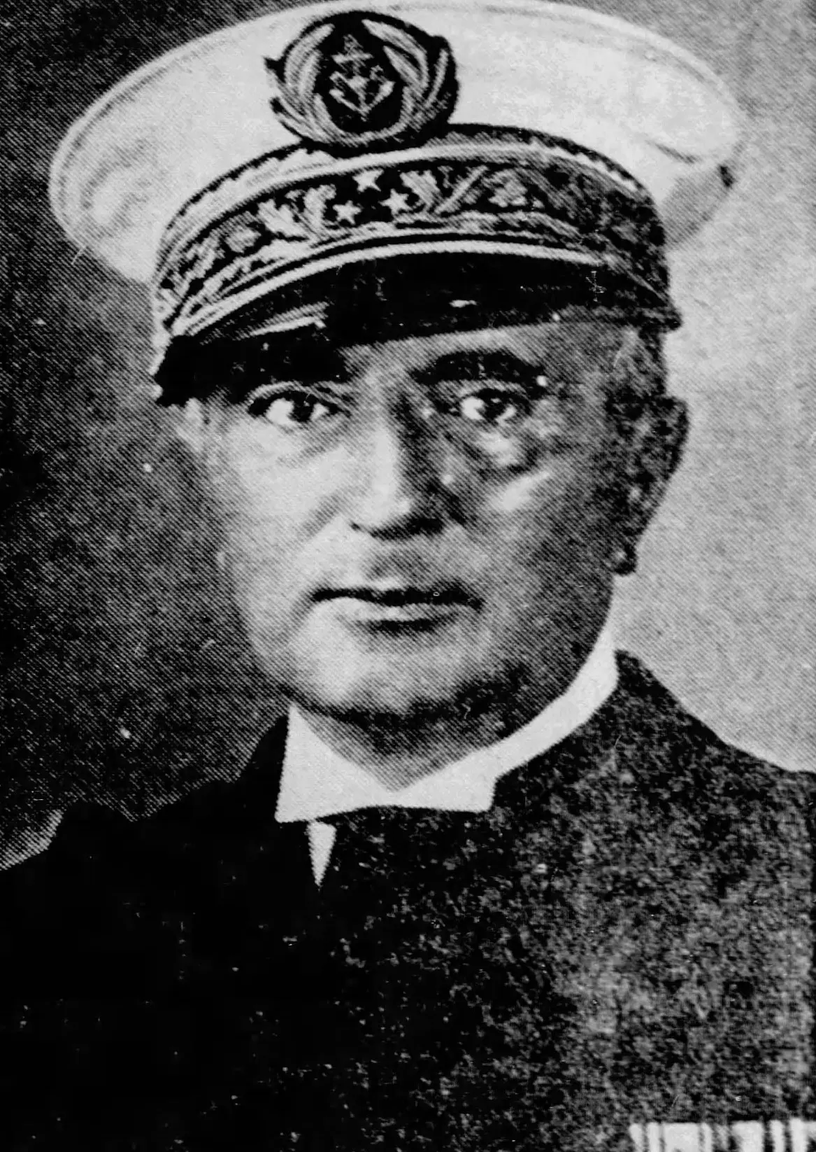 A black and white portrait of the French admiral Jean Francois Darlan in his dress uniform.